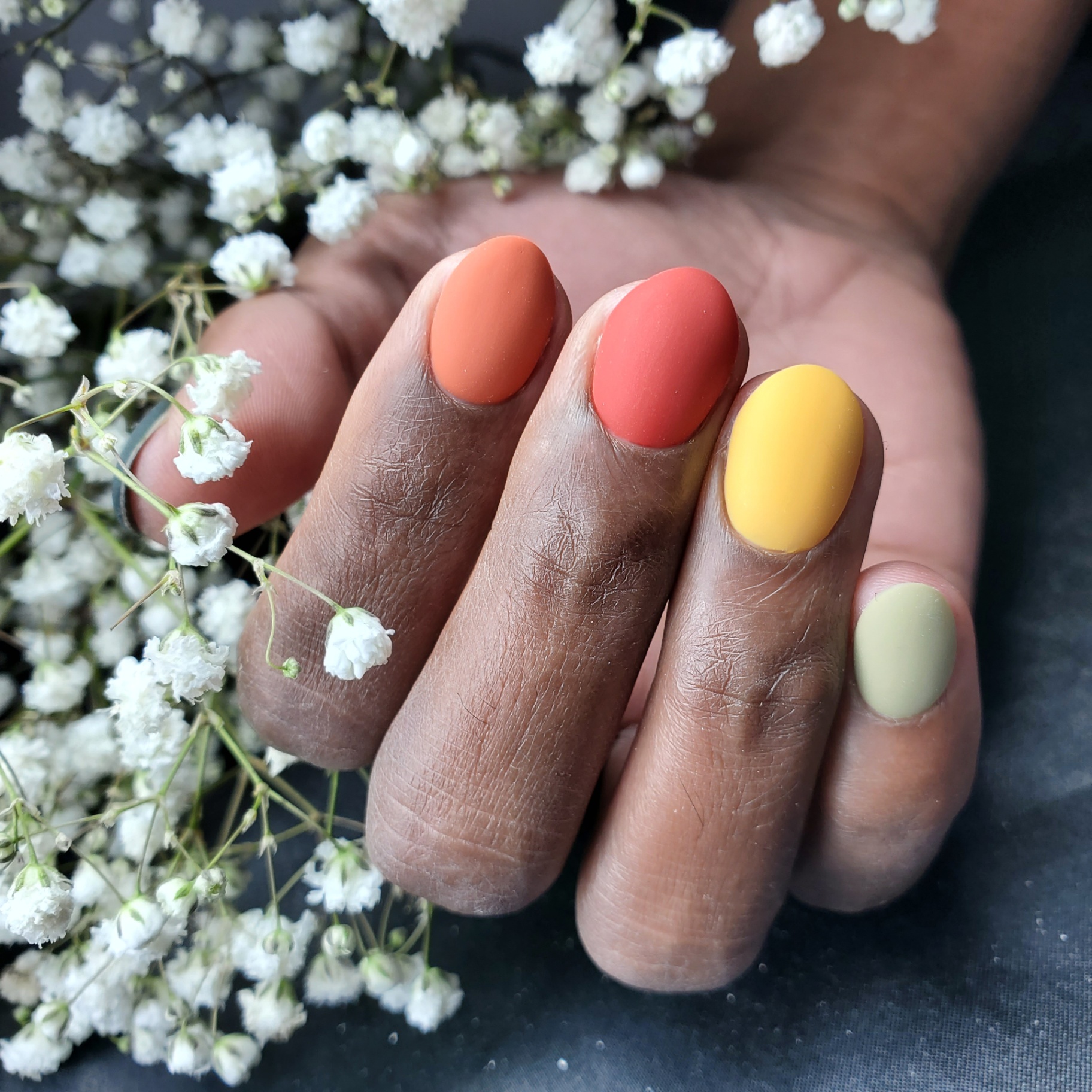 Matte multicolor palette manicure in warm tones